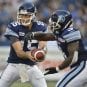Toronto Argonauts tailback Cory Boyd takes a handoff from quarterback Ricky Ray during a game in August 2012.