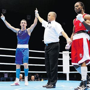Freddie Evans of Great Britain is declared the winner of his boxing match with Canada's Custio Clayton at the 2012 London Olympics.