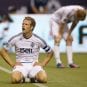 Vancouver Whitecaps FC players Jay Demerit and Barry Robson are shown on the pitch at BC Place.