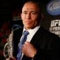 Canadian MMA fighter Georges St-Pierre is shown with the UFC welterweight belt.