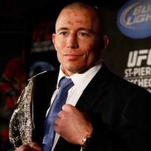 Canadian MMA fighter Georges St-Pierre is shown with the UFC welterweight belt.