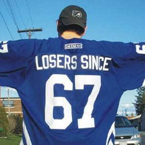 A "fan" makes his opinion known with a custom-made Toronto Maple Leafs jersey.