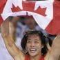 Canada's Carol Huynh (C) celebrates afte