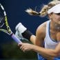 Eugenie Bouchard Swinging Tennis Racquet