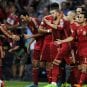 Spain's players celebrate Iniesta's goal against Slovakia during their Euro 2016 qualification soccer match in Oviedo, Spain