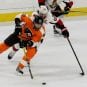 NHL 2016 - Nov 15 - OTT vs PHI - Right Wing Jakub Voracek (#93) of the Philadelphia Flyers keeps the puck out of the reach of Defenseman Erik Karlsson (#65) of the Ottawa Senators