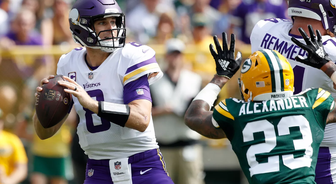 Vikings quarterback Kirk Cousins plays against the Packers