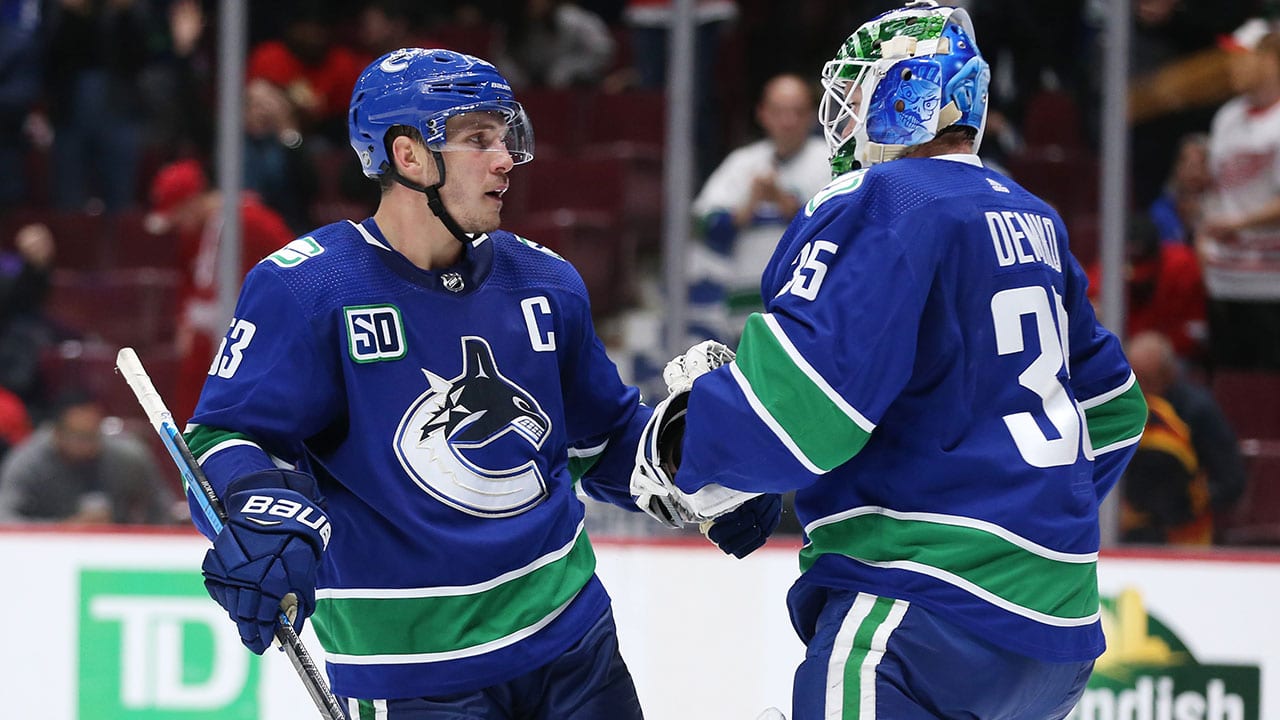 Bo Horvat and Thatcher Demko of the Vancouver Canucks